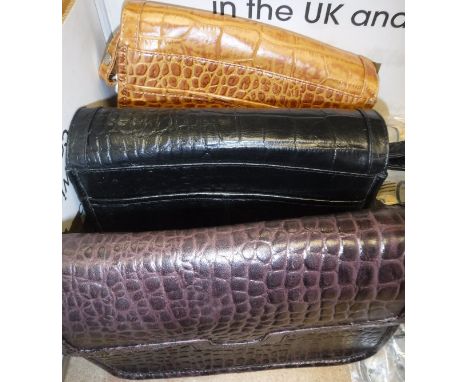 Three various leather Osprey handbags, one black, one dark brown and one light brown