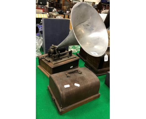 A "The Dulcetto" oak cased phonograph with aluminium horn  CONDITION REPORTS The phonograph winds up but we are unable to sta