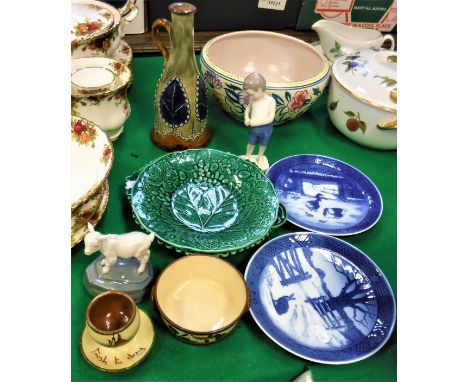 A Poole Pottery fruit bowl with floral decoration, two green leaf dishes, Watcombe Torquay pottery bowl and similar egg cup, 