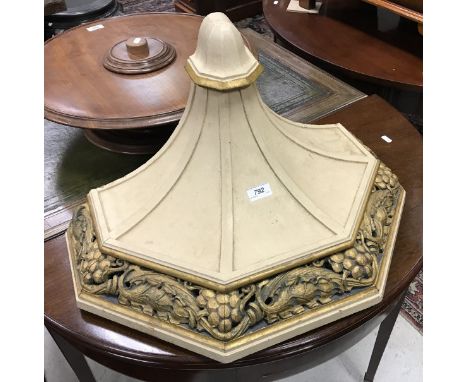 A large cream painted and gilded oak wall bracket in the Classical style with grape and vine decoration