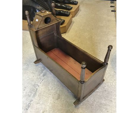 A 19th Century Scottish oak crib with dovecot caddy top over plan sides and rockers