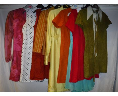 A collection of vintage 1960's clothing, mainly Sizes 8-10, comprising an orange suede dress, cream and blue polka dot dress,