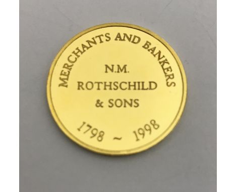 A 14 carat gold medallion inscribed "Merchant and Bankers N.M Rothschild &amp; Son 1798-1998", approx 11.7 g