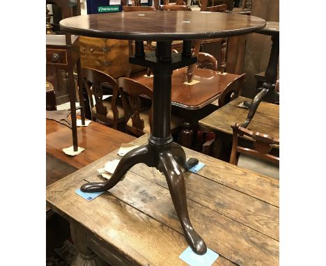 A Georgian mahogany tea table, the circular snap top on birdcage turned pedestal to cabriole tripod base