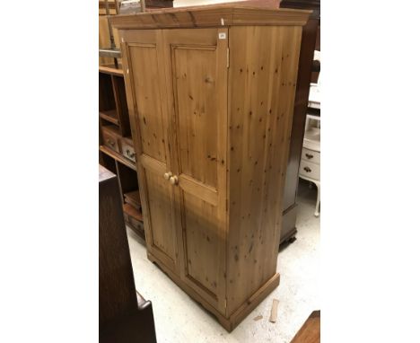 A modern pine two door wardrobe and a Victorian mahogany twelve section stick stand