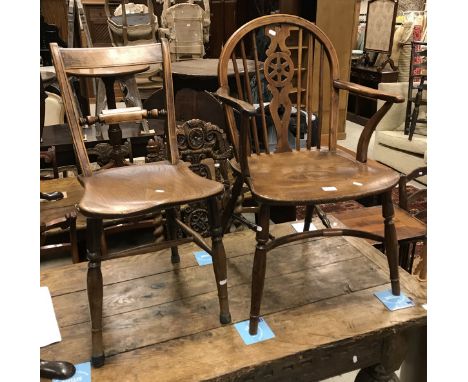 A 19th Century Thames Valley yew wood and elm wheel and stick back elbow chair on turned legs united by a crinoline stretcher