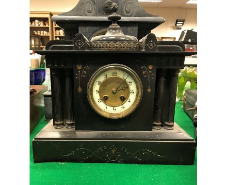 A 19th Century French black marble cased mantel clock of architectural form with eight day movement and Arabic numerals