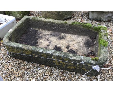 A natural stone D shaped trough