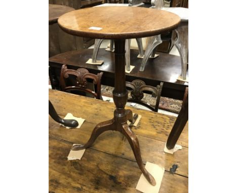 An early 19th Century mahogany occasional table, the circular top on a turned pedestal to cabriole tripod base
