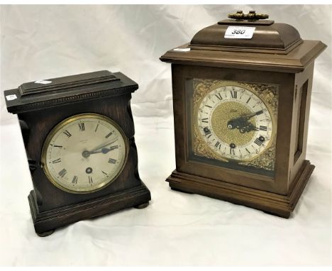 An early 20th Century oak cased mantel clock by G. Atkins of Arundel bearing label to base, the silvered dial with Roman nume