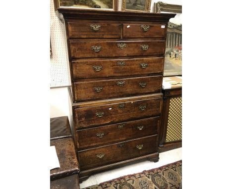 A late 18th Century North Country oak and cross-banded chest on chest, the upper section with two short over three long gradu
