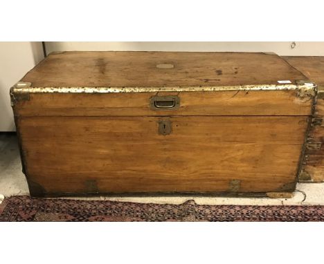 A 19th Century camphor wood trunk with brass corners and embellishments