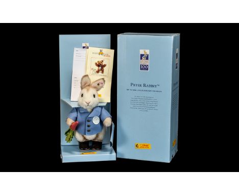 Steiff Peter Rabbit 100 Years Anniversary Edition in original box with paperwork, and Steiff button in ear. Excellent conditi