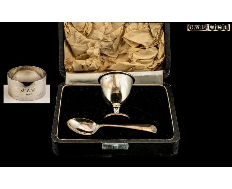 A Silver Christening Set to include an egg cup, spoon and associated napkin ring. Hallmarked for Sheffield. Gross Weight 72 g