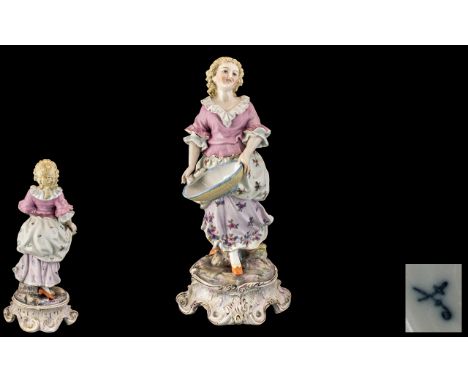 Sitzendorf Hand Painted Porcelain Figure depicting a young lady in 19thC dress, holding a large bowl; Sitzendorf marks to bas