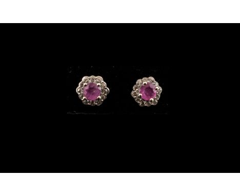 Pink Sapphire Halo Stud Earrings, round cut pink sapphire solitaires, each accented with a hexagonal frame of natural zircons