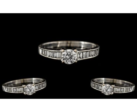 18ct White Gold - Nice Quality Diamond Set Ring. The Central Round Brilliant Cut Diamond of Excellent Colour, to Either Side 