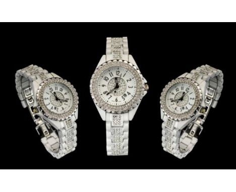 Ladies White Ceramic Stone Set Quartz Fashon Wrist Watch. Serial No Z.G.58096. Features Luminous Hands / Markers, Stone Set t