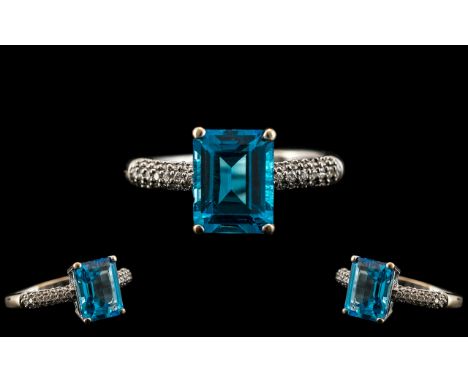 18ct Gold - Superb and Attractive Aquamarine and Diamond Set Dress Ring. The Step-cut Aquamarine of a Deep Rich Colour with M