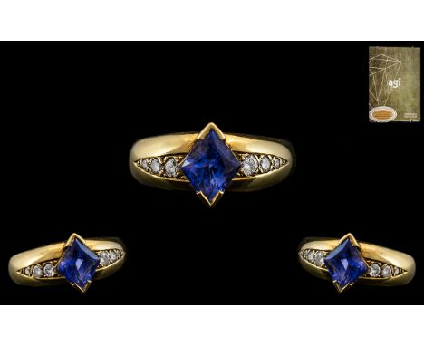 18ct Yellow Gold - Attractive Sapphire and Diamond Set Dress Ring. The Central Cornflower Blue Sapphire of Excellent Colour w