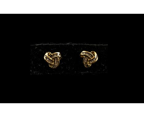 Diamond Triple Knot Stud Earrings, an attractive design set with baguette cut diamonds of good colour held in 14ct gold verme