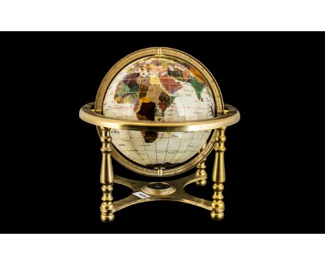 World Map Gem Globe on a brass gimbel, decorated with mother of pearl. Height 14". 