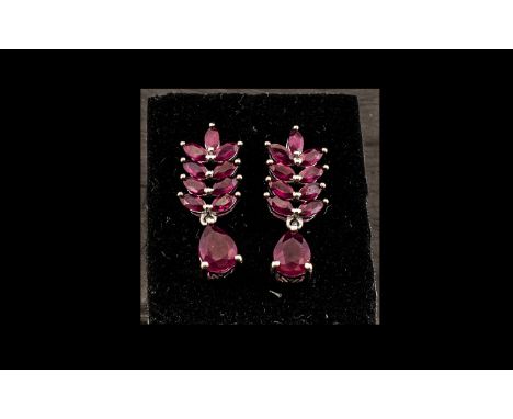 Ruby Chevron and Drop Earrings, 7cts of rubies, each earring having four pairs of marquise cut rubies set in a vertical row o