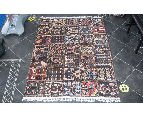 A Genuine Excellent Quality Persian Bakhtiari Carpet/Rug decorated in a traditional Persian panel design on red ground. Hand 