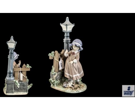 Lladro Figure of a girl sweeping by a lamp post with a kitten, measures 34 cms high. Impressed number to base 5286.  Excellen