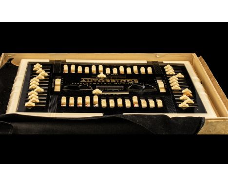 Art Deco Bakelite Autobridge Luxury Model Series 51, to include black and white playing board, with 13 double sided deal shee
