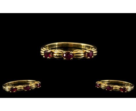 14ct Gold Attractive 3 Stone Ruby Set Ring. Marked to Interior of Shank 585. Rubies of Good Colour, Ring Size N. The Shank an