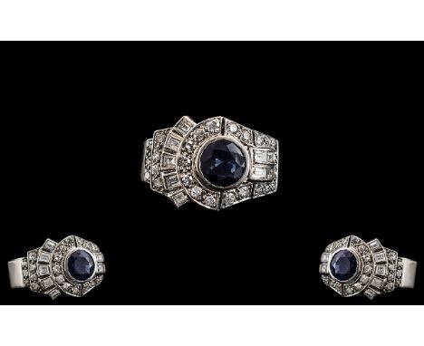 Art Deco Period Superb Platinum Diamond and Sapphire Set Cocktail Ring. The Central Blue Sapphire Surrounded by Baguette and 