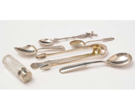 A group of small silver items, including; a Georgian pair of Newcastle silver sugar tongs, an Edwardian scent bottle; a Victo