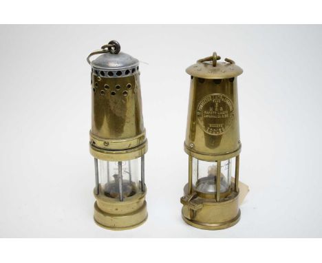 An Eccles brass miners lamp; together with another miners lamp. (2) 