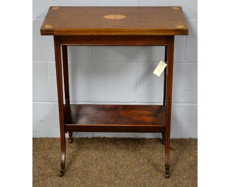 An Edwardian fold-over card table of small proportions, the hinged rectangular top with inlaid shell motifs and spandrels enc