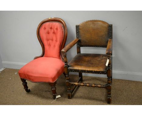 A Victorian button balloon back easy chair, upholstered in red material, shaped seat rail, turned feet; and a Jacobean style 