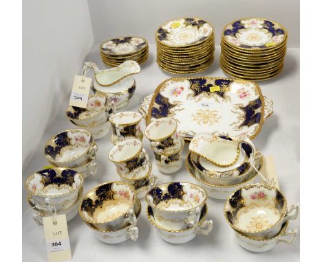 A Coalport 'Batwing' tea and coffee service, each piece decorated with a floral spray between blue and gilt borders, comprisi
