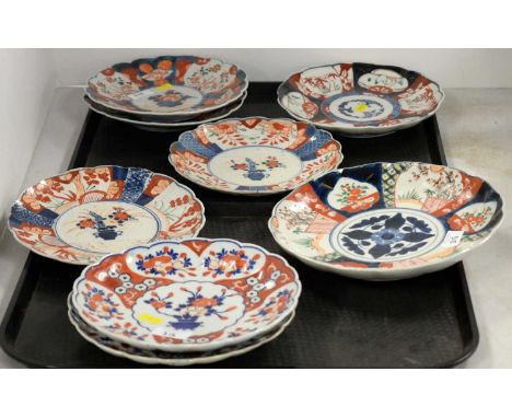 Three pairs of Japanese Imari plates, each decorated with a central floral bouquet within an Imari border; together with two 