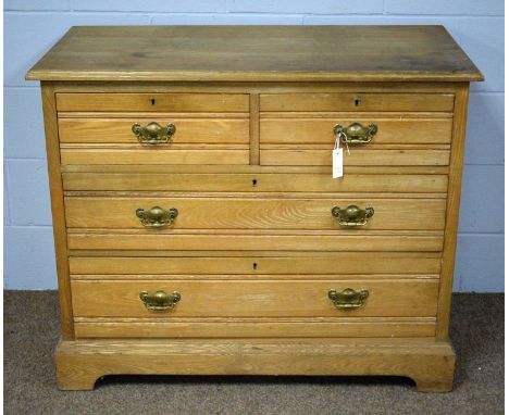 A late Victorian light oak chest of drawers, the rectangular top above an arrangement of two short drawers over two long grad