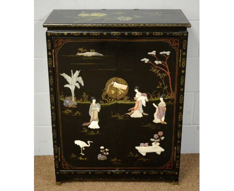 A 20th Century Chinese black lacquered side cabinet, the rectangular top decorated with birds amongst foliage above a pair of
