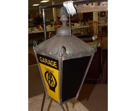 An early 20th Century Automobile Association garage lamp, of tapering form, with scrollwork fitting, approximately 97cms high