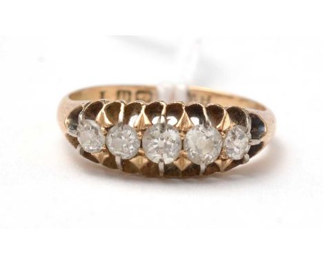 An early 20th Century five-stone diamond ring, on a 9ct gold shank, size K 1/2, 2.5g gross.