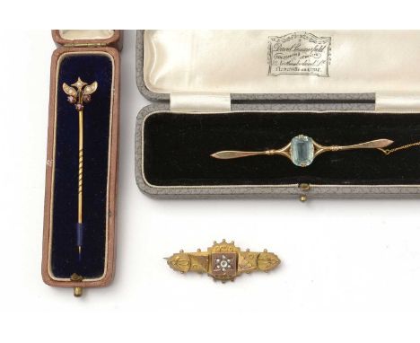 Victorian and Edwardian bar brooches and a stick pin, including a 9ct gold Etruscan influenced bar brooch, and a garnet and s