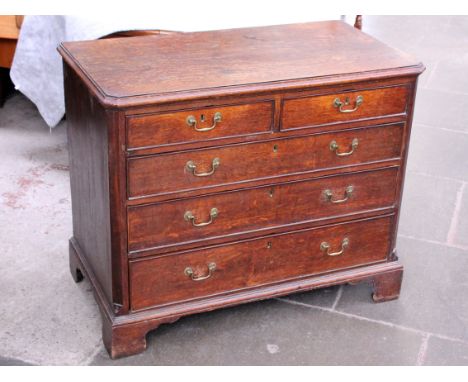 A George III oak chest of drawers with brass loop handles and bracket feet. W100cm D53cm H81cm
 
Condition - good, a couple o