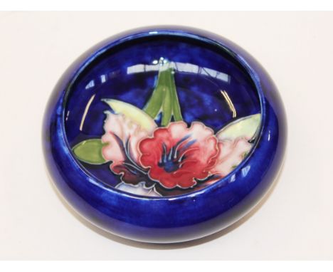 A Moorcroft pottery dish. Diam. 11.5cm. Condition - very good, no damage, minor crazing only.