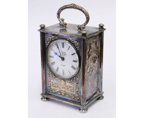 A French silver plated 8 day alarm clock. H11cm