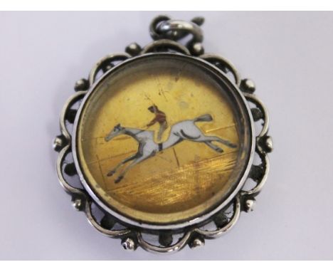 A silver horse racing pendant compass, unmarked. Diam. 2.5cm