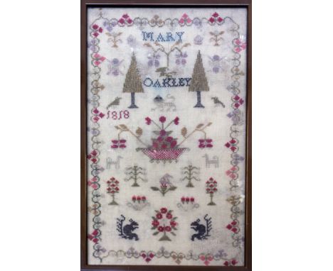 A sampler by Mary Oakley 1818. 18cm x 32cm. Condition - minor losses in places, a little discoloured, no repairs.