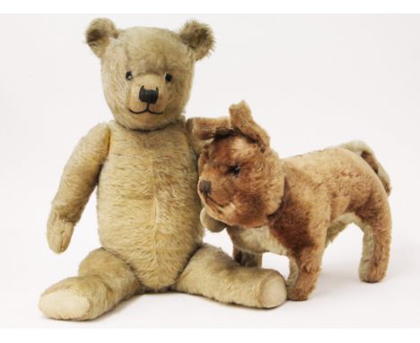 A Chiltern gold mohair teddy bear circa 1930 together with a plush dog of similar age. Condition - both toys appear quite wor