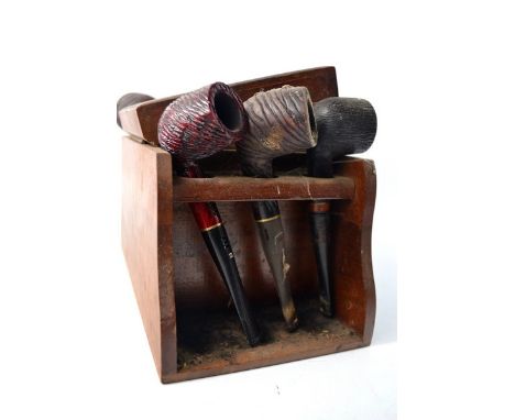 An old pipe stand with old original pipes, some early 19th century